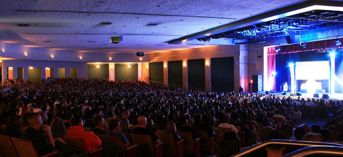 People watch a concert at the Kiva Auditorium