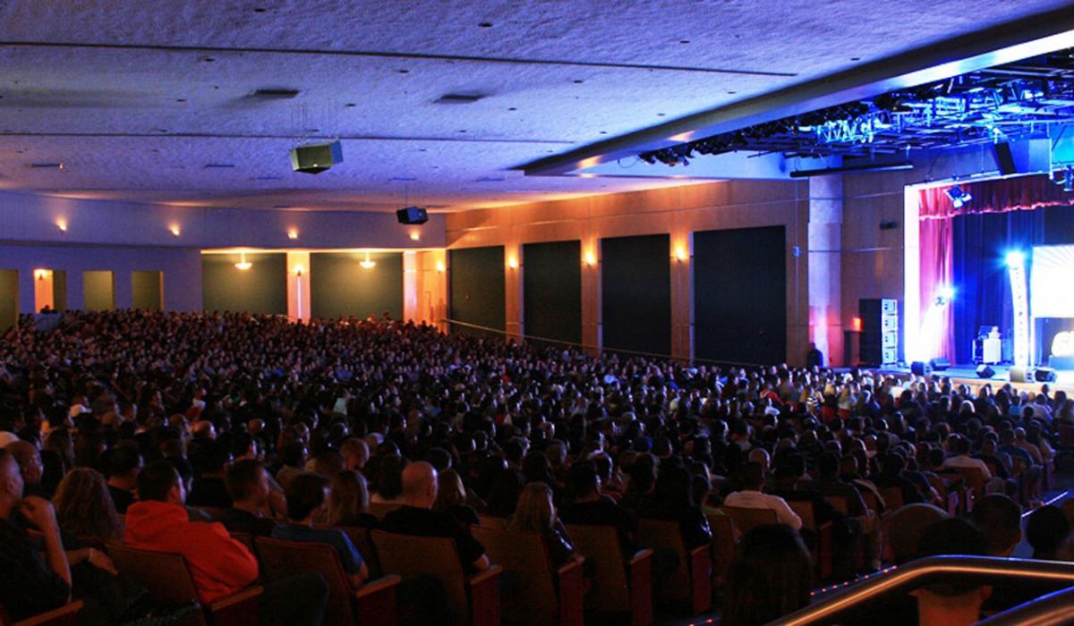 People watch a concert at the Kiva Auditorium