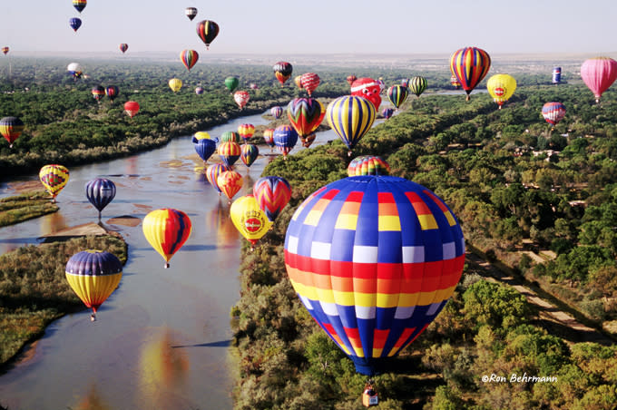 Hot air balloons float over the Rio Grande