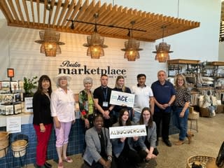 ACE graduates pose at Poulin Marketplace