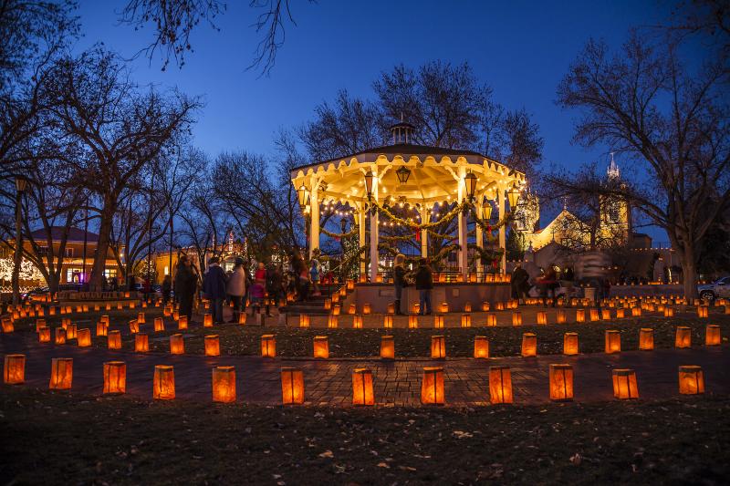 Hundreds of luminarias adorn the gazebo in Old Town at night.
