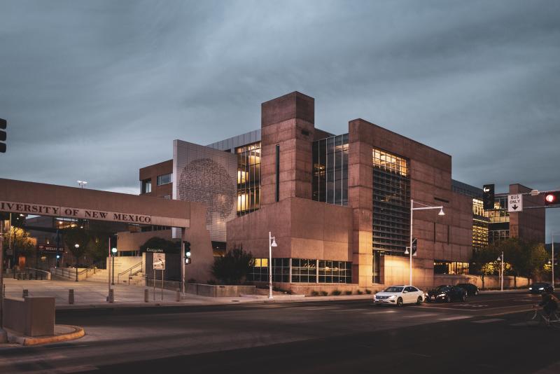 The exterior of a building on UNM's campus at dusk.