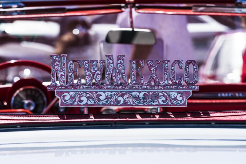 A closeup of the interior of a lowrider car that says New Mexico.